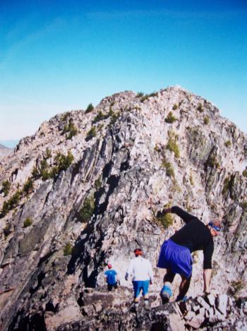 After ditching packs, the guys are pumped for the final push to the slabby, and in no way shabby, quartzite summit of Little Hi Peak. Rick Baugher photo.