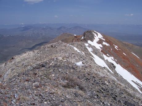 The pristine 10824' summit of North Mass. View N to Donkey Hills with Lemhi Range on horizon. Photo by Rick Baugher 5/16/07.