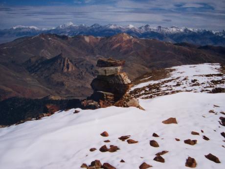 From the snowcapped summit of Rosenkrance Peak many of Idaho's highest mountains can be seen. This view NE on 9/18/03 looks past Porphyry Peak to the Borah section of Lost River Range. Photo by Rick Baugher.